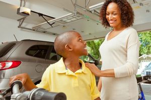 child in garage with mother